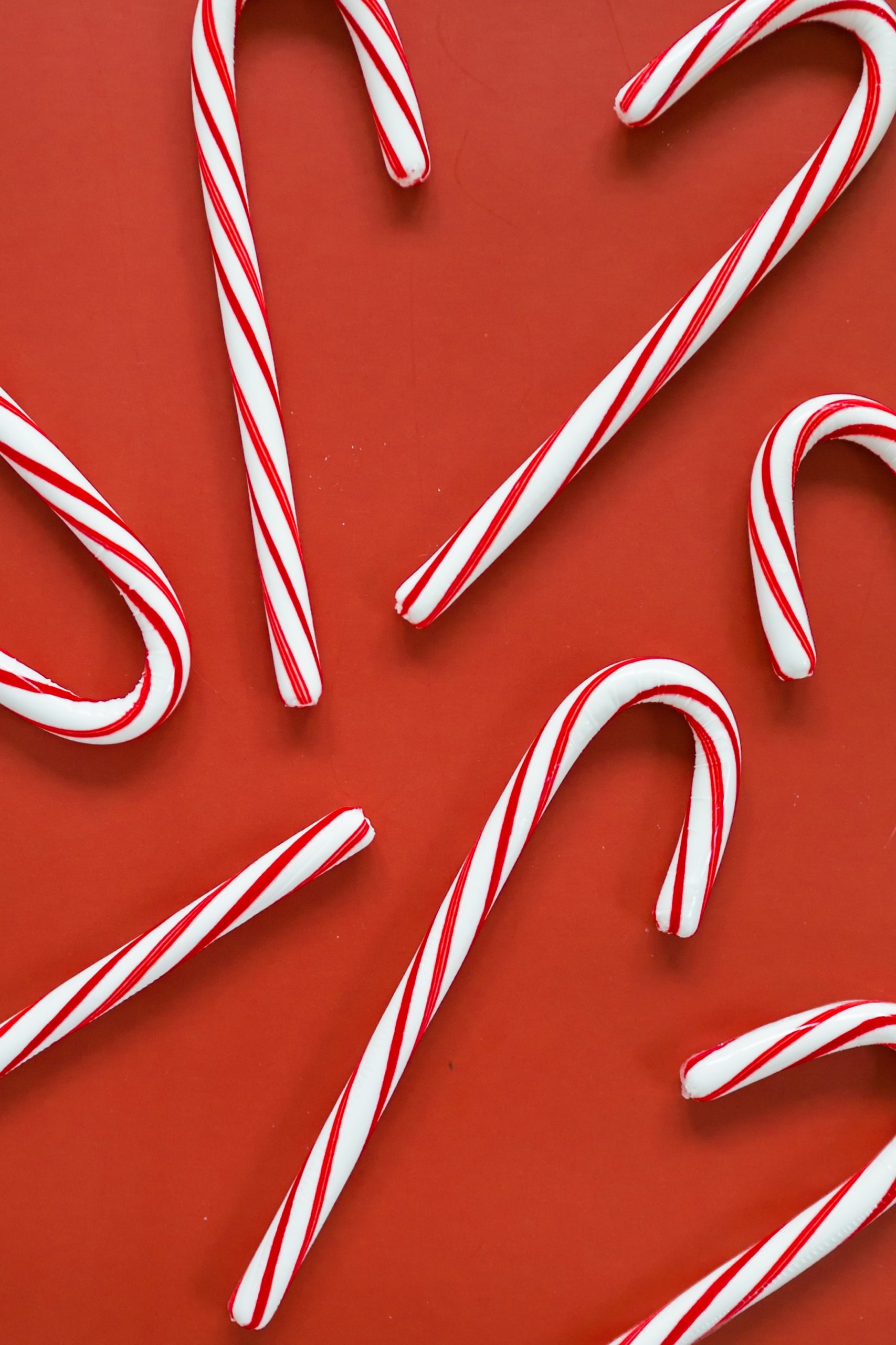 Red background with red and white candy canes