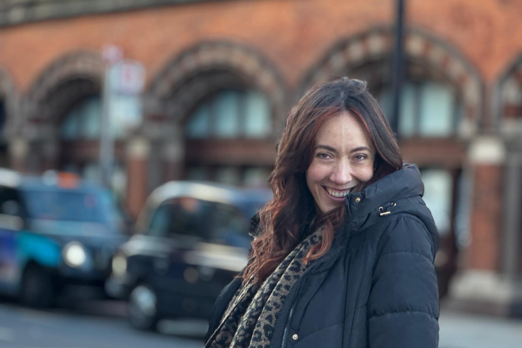 Image: Photo of Kayleigh Vermont looking at the camera with a blurred street view behind