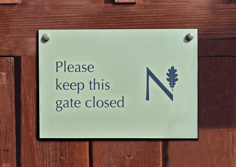 Image: St Neots school signage saying Keep this gate closed with their logo