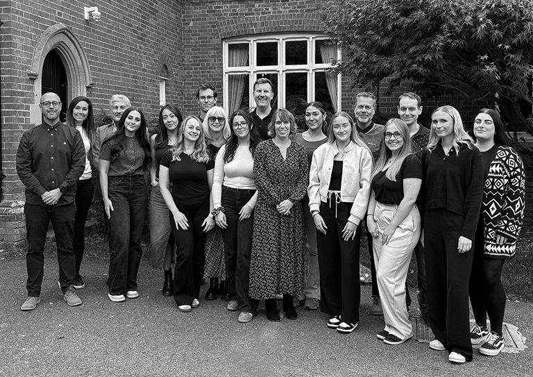 Image: A black and white photo of the Clone team